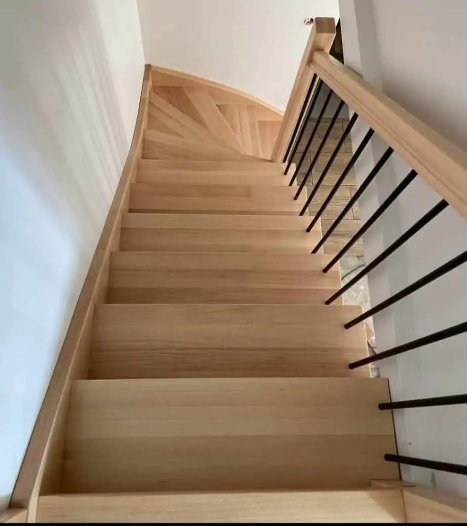 Oak staircase with black metal spindles, seen from the top